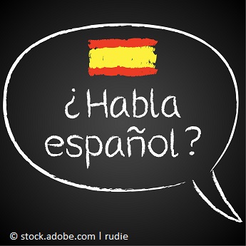 Foto mit Sprechblase auf Kreidetafel 'habla espanol'